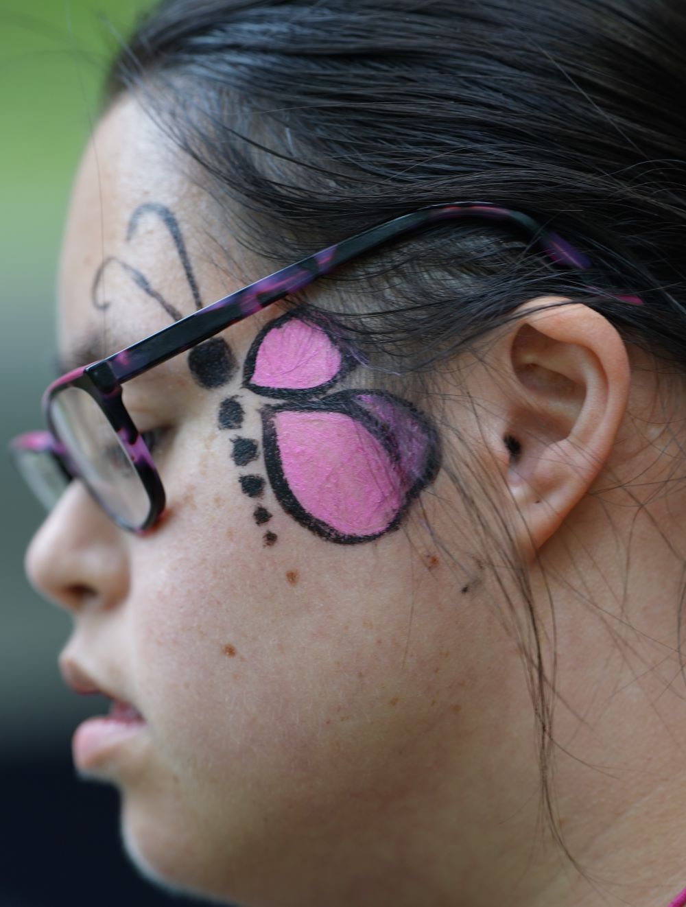 butterfly painted on face