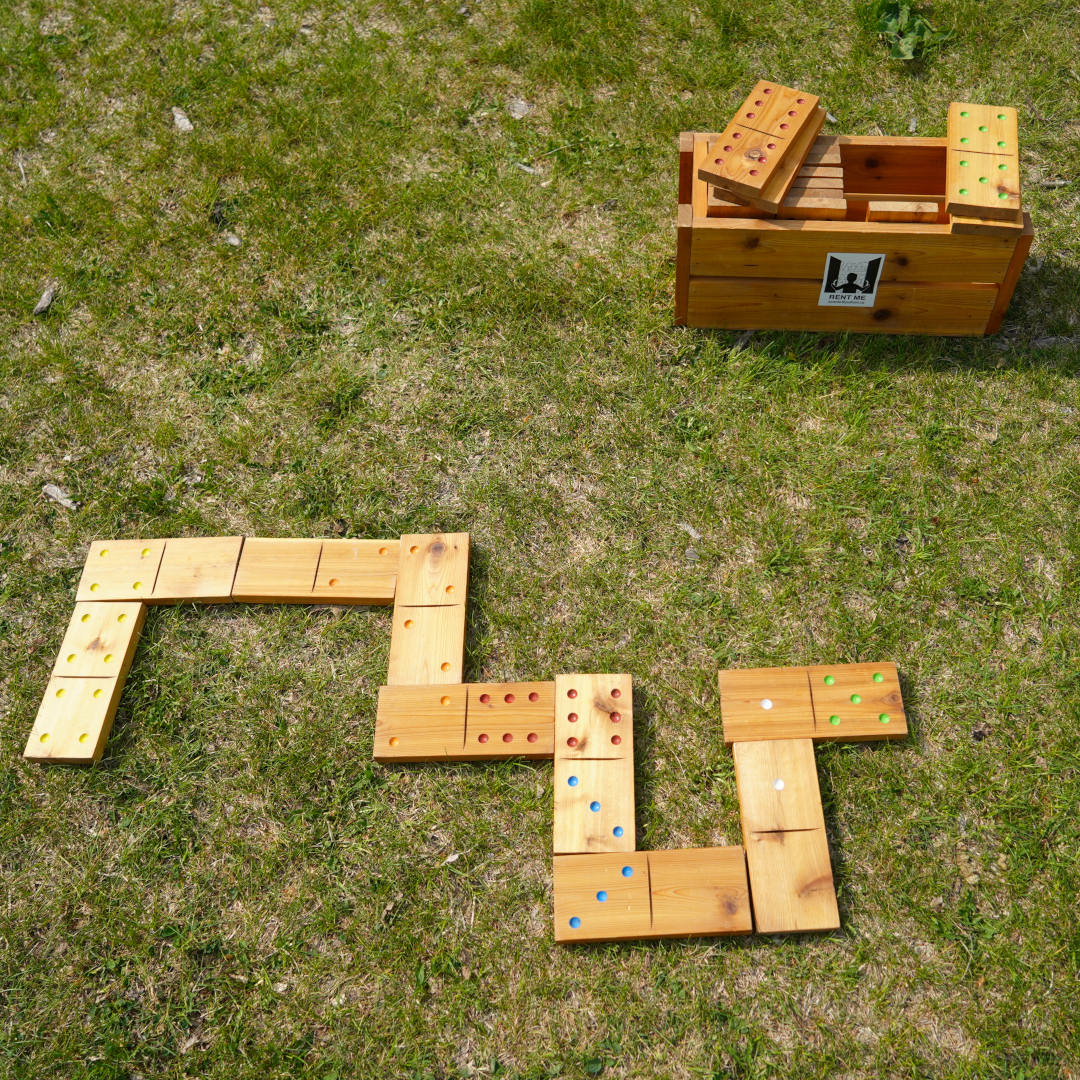 large dominos set up on grass