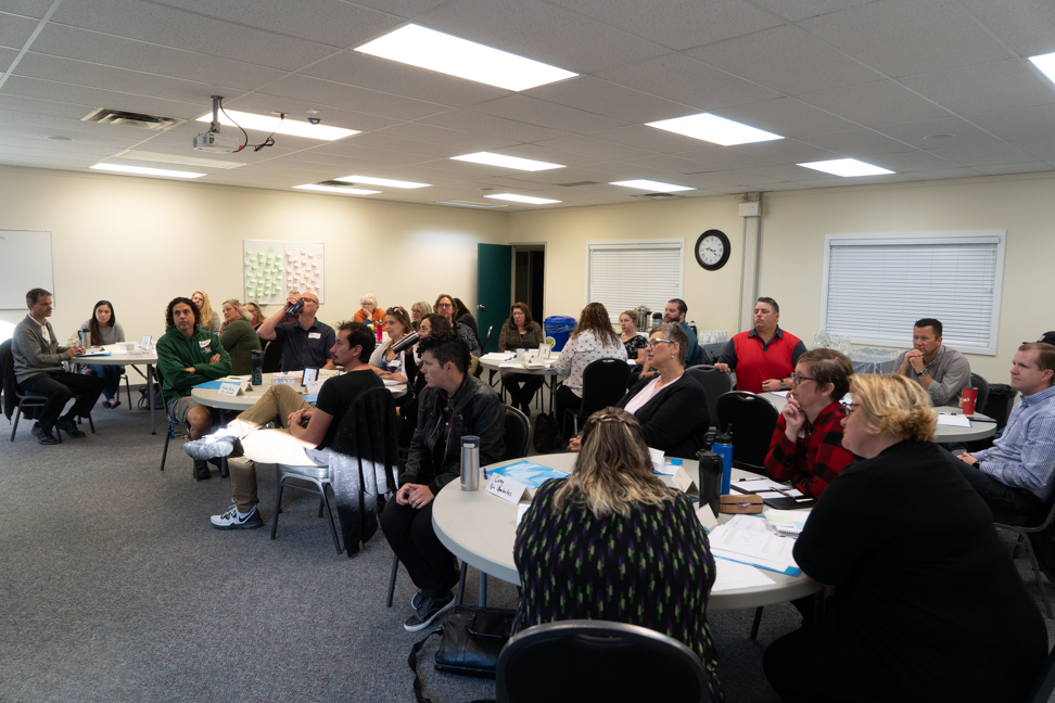 this image shows a group of people in a classroom