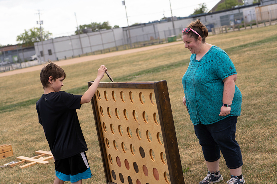 two people play a giant game of connect four